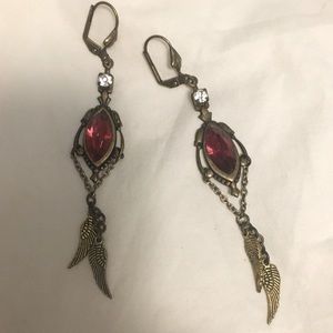 Beautiful feather earrings with red jewel